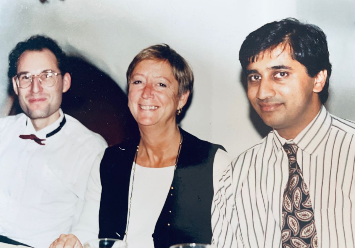 A photograph of Christine Guthrie with former students James Umen and Hiten Madhani