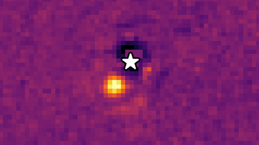 A yellow and orange blob of light appears against a purple grainy background.