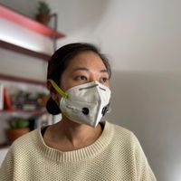 photograph of a woman wearing a face mask embedded with SARS-CoV-2 sensors