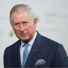 A photo of King Charles III, then formally Prince of Wales, wearing a dark suit, shown from the shoulders up.