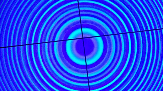 Concentric rings of light seen through crosshairs of a Fabry-Pérot interferometer.