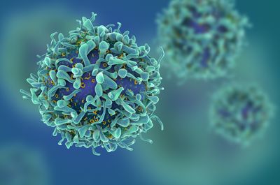 Artist&rsquo;s rendering of aquamarine T cells in front of a blue and green background.