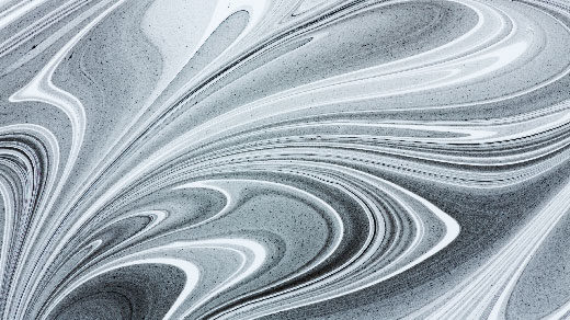 Photo of black and white swirls of mixing paint