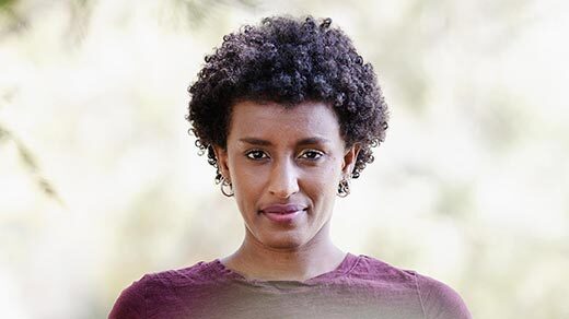 A close-up, head-on portrait of computer scientist Rediet Abebe.