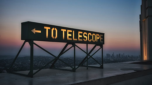 Photo of a sign reading “To Telescope” near Griffith Observatory in Los Angeles.