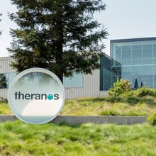 A Theranos sign outside the company's headquarters