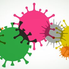 Illustration of viruses represented with different colors overlapping each other.